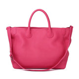 Large pink leather tote bag with shoulder strap and dual handles on white background