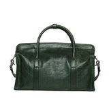 Green leather Boston bag with dual handles and detachable shoulder strap, shown on white background