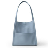 Light blue grain cowhide leather tote bag with minimalist design and wide shoulder strap