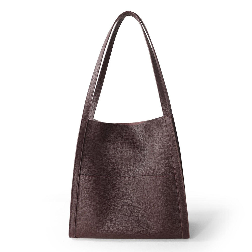 Minimalist brown grain cowhide leather tote bag with shoulder straps and front pocket