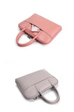 Two slim leather laptop bags for women, one pink and one taupe, with top handles and front pocket.