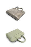 Two slim leather women's laptop briefcases, one in taupe and one in sage green, with top handles.