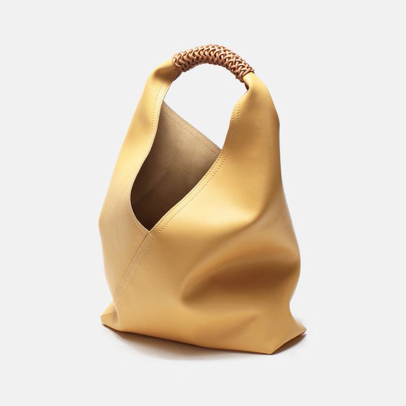 Minimalist yellow genuine leather tote bag with woven handle, modern women's fashion accessory