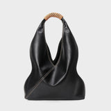 Minimalist black genuine leather bucket bag with woven handle, fashion tote for women