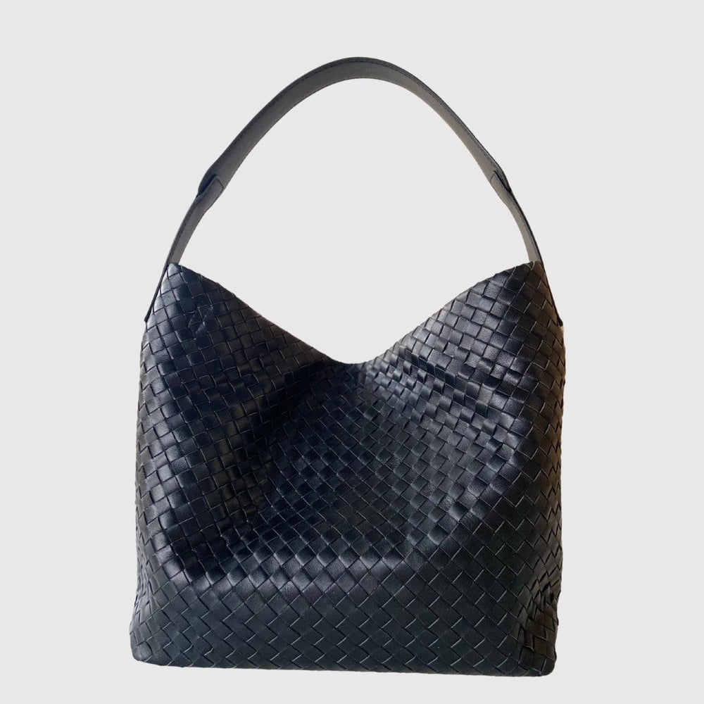 Medium black lambskin leather woven tote bag with single shoulder strap on white background
