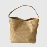 Beige woven lambskin leather tote bag with a single shoulder strap on a plain background.