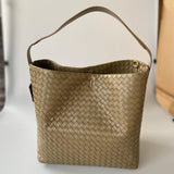Medium beige woven lambskin leather tote bag with single shoulder strap on white background