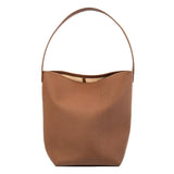 Tan minimalist leather bucket bag with shoulder strap, large unisex tote bag