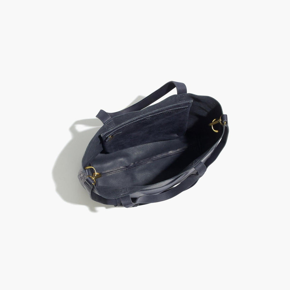 Top view of open minimalist full grain leather tote bag with spacious interior and zip pocket