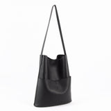 Black cowhide leather tote bag with two front pockets and long shoulder strap
