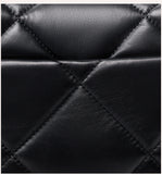 Close-up of black quilted genuine leather with diamond stitching, luxury bag texture