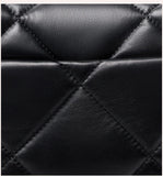 Close-up of black quilted genuine leather with diamond stitching, luxury bag texture