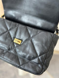 Quilted black lambskin leather shoulder bag with gold turn-lock clasp, luxury finish
