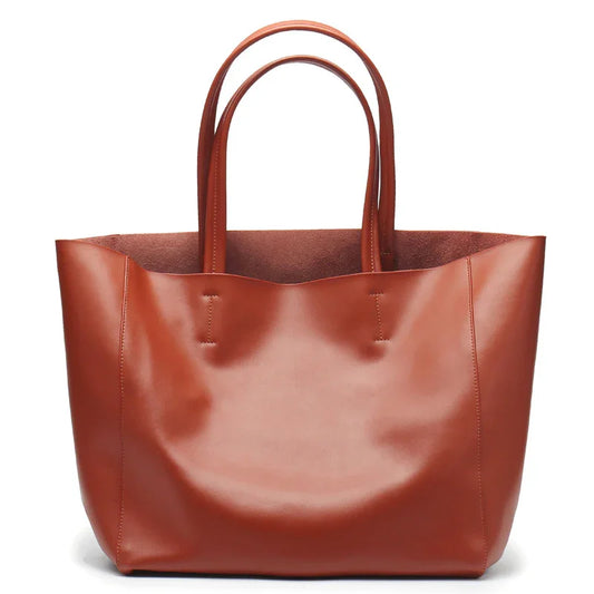 Large beige genuine leather tote bag with double handles, ideal for laptop or books