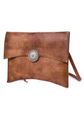 Handcrafted brown leather clutch bag with decorative metal accent and shoulder strap