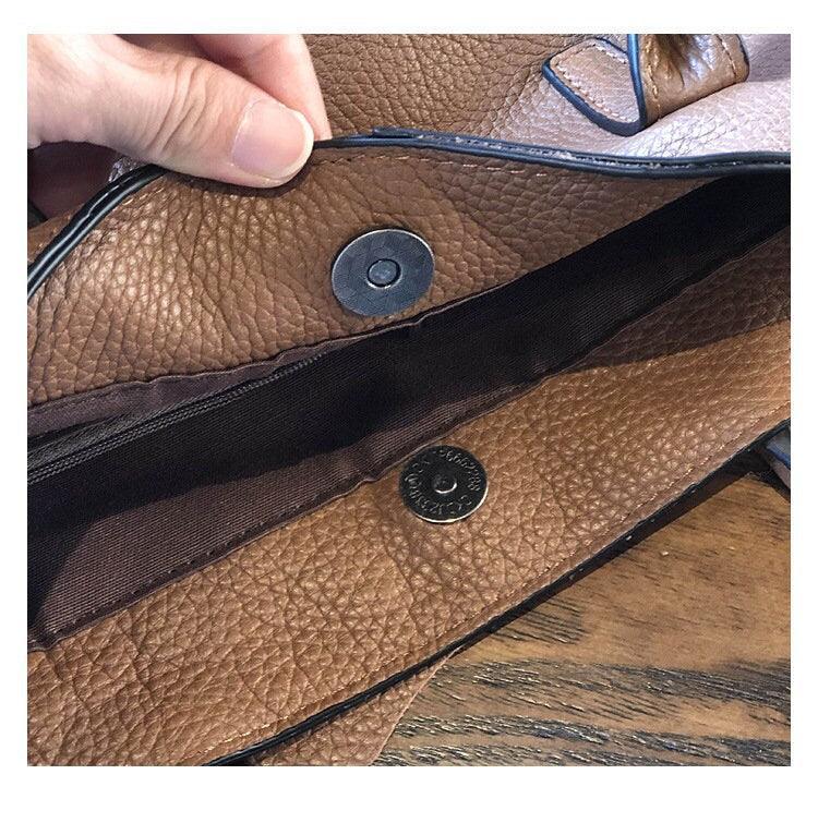 Interior of a brown full grain leather crossbody bag with magnetic snap closure