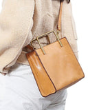 Genuine cowhide leather shoulder bag with gold handles, stylish handmade handbag for women