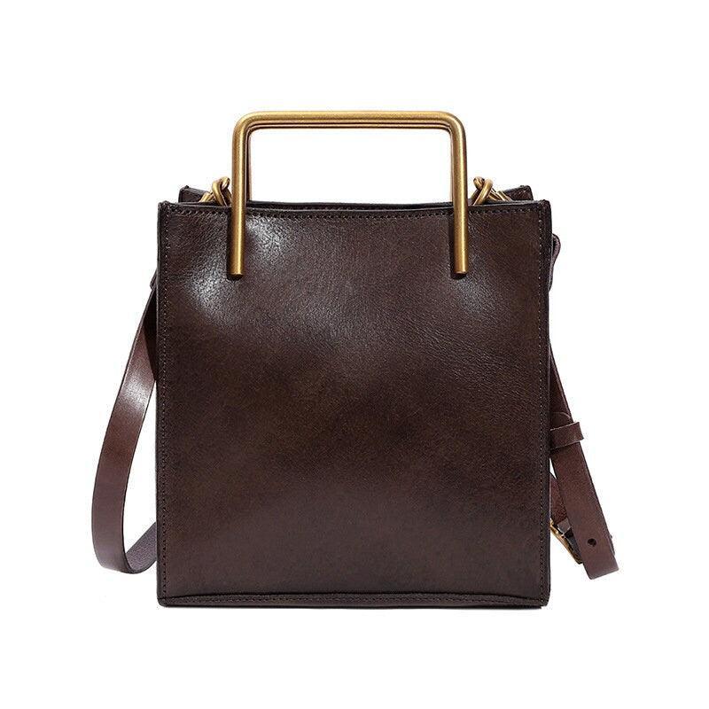 Dark brown genuine cowhide leather handbag with gold handles and shoulder strap