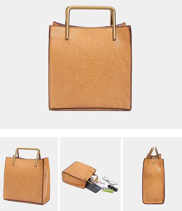 Tan cowhide leather shoulder bag with gold square handles, modern handbag for women