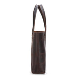 Side view of a large handcrafted dark brown leather tote bag with double handles