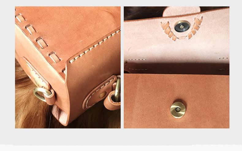 Close-up of handcrafted tan leather shoulder bag with visible stitching and brass hardware