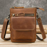 Handcrafted brown full grain leather crossbody bag with front zipper pocket and adjustable strap