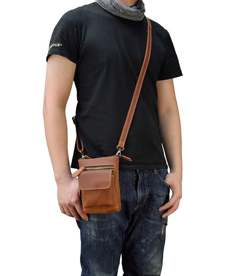 Handcrafted men's full grain leather crossbody bag with zipper pouch worn on shoulder