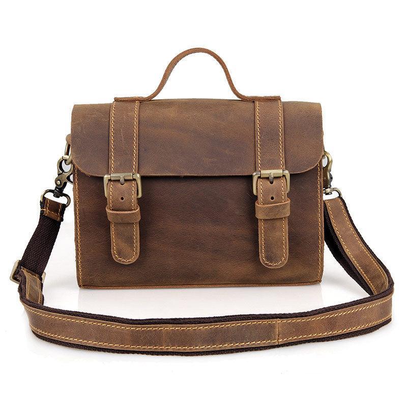 Handcrafted vintage brown leather shoulder bag with buckles and adjustable strap
