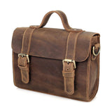 Handcrafted brown leather shoulder bag with vintage style, two front buckles, top handle