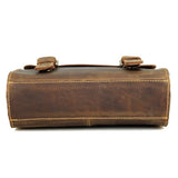 Bottom view of a handcrafted vintage style brown leather shoulder messenger bag