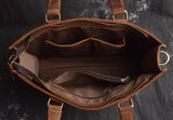 Interior view of brown full grain leather messenger bag with multiple pockets and zipper compartments