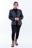 Woman wearing slim fit black genuine leather biker jacket with front zippers