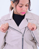 Woman wearing slim fit grey genuine leather biker jacket with zippers and snap collars