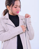 Woman wearing slim fit genuine leather biker jacket in light grey with front zipper detail