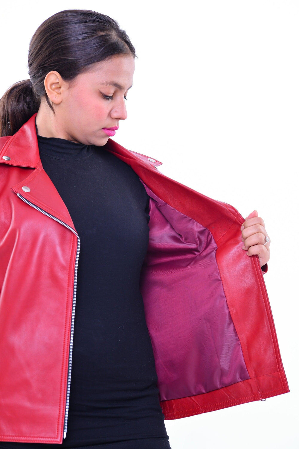 Woman modeling slim fit red genuine leather biker jacket with visible inner lining