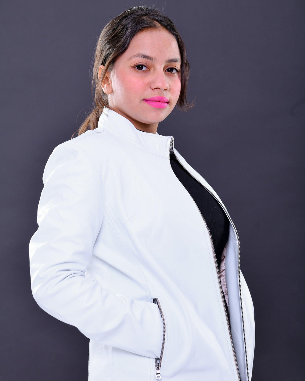 Woman wearing slim fit genuine leather white biker jacket with zipper detail