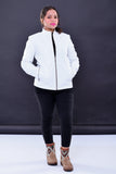 Woman wearing a slim fit white genuine leather biker jacket with front zipper pockets
