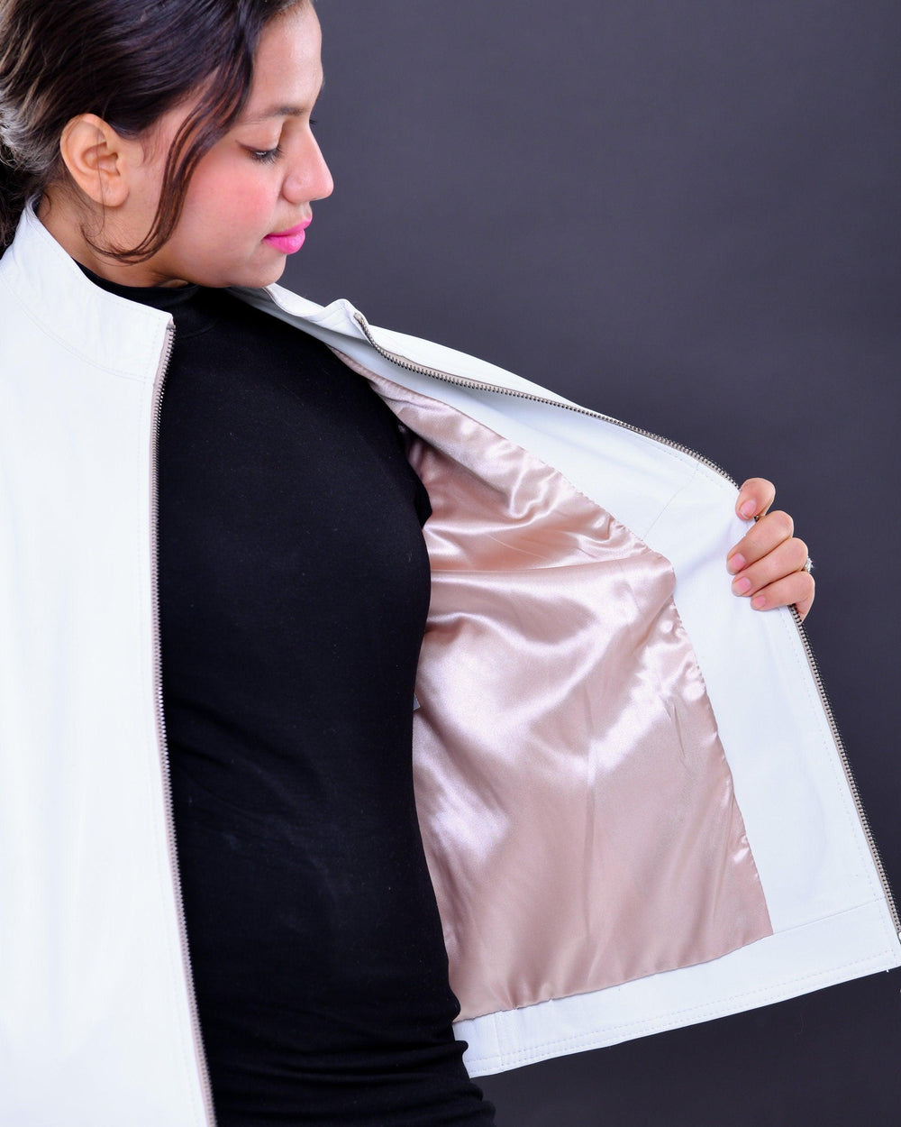 Woman modeling slim fit white genuine leather biker jacket with satin lining