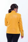 Woman in slim fit yellow genuine leather biker jacket with zip sleeves, back view