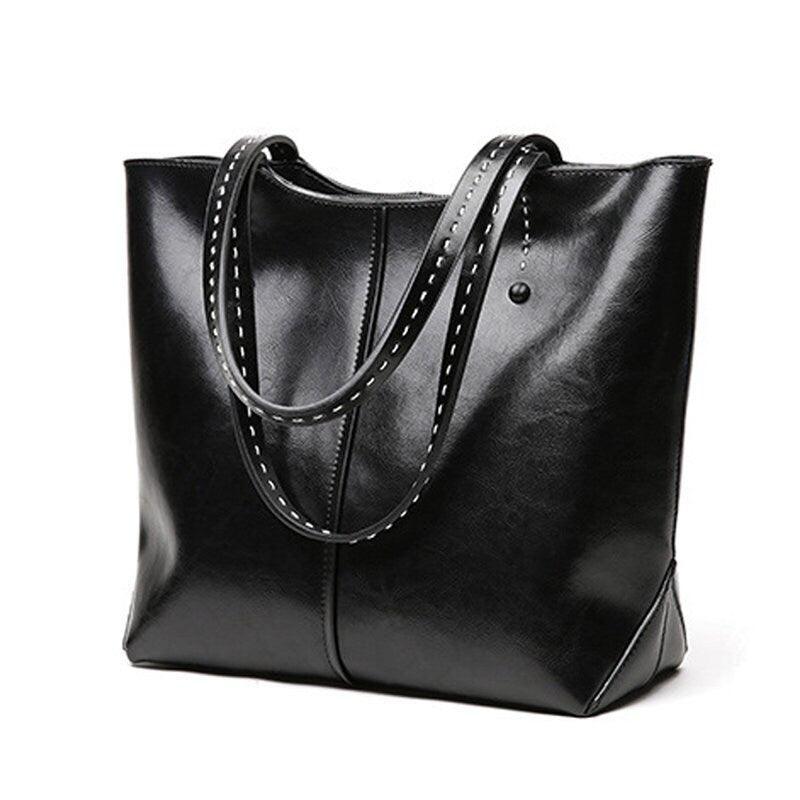 Black leather tote bag with double handles, minimalist design, large daily handbag