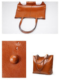 Brown genuine leather tote bag with stitched handles and minimal design, detailed texture shown.