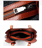 Brown leather tote shoulder bag with zipper detail and spacious patterned interior