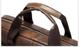 Brown leather laptop shoulder bag with top handles and gold zipper detail