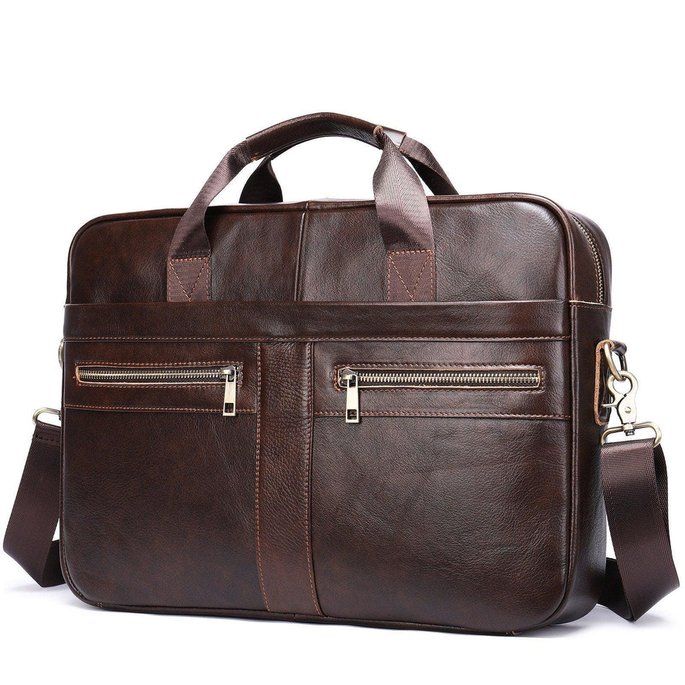 Dark brown leather shoulder laptop bag with double handles, front zipper pockets, and detachable strap