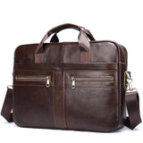 Dark brown leather shoulder laptop bag with double handles, front zipper pockets, and detachable strap