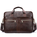 Brown leather shoulder laptop bag with dual top handles, front zip pockets, and adjustable strap