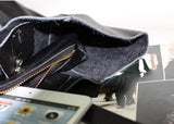 Interior view of black full grain leather tote bag with zip pocket and tablet inside