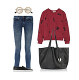 Black full grain leather tote bag with long handles styled with jeans, red sweater, sneakers, and sunglasses