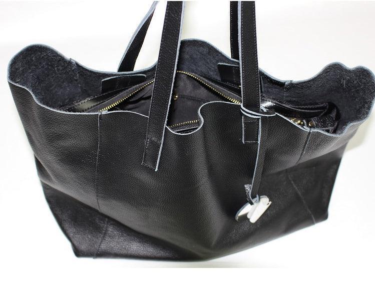 Black full grain leather tote bag with zipper pouch and long handles, open top view
