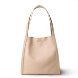 Beige grain cowhide leather tote bag with minimalist design and double shoulder straps